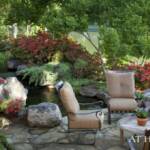 "A lower-level patio overlooks the koi pond and fire pit."