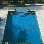 "The pool's unusual T-shape creates a wading pool for children, making the area very family friendly."
At Home in Arkansas | © 2005

Pool Construction: Brooks Pool Co., Inc. 
General Contractor: Jack Hartsell Construction, Little Rock, AR.
Photography: Larry Pennington | © 2005